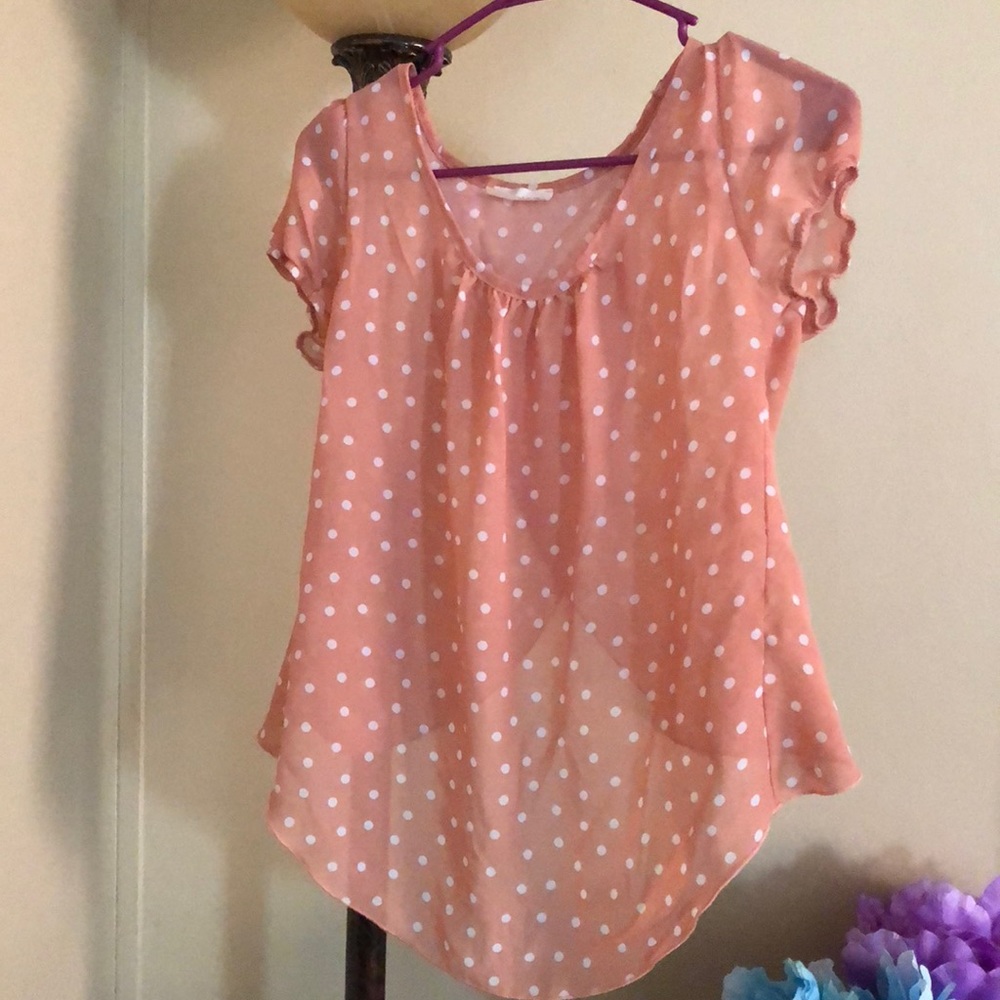 Sheer, polka dot blouse.